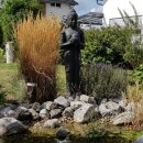 Standing Buddha statue with pot, 151 cm, stone figure, garden deco, black antique, frost-proof